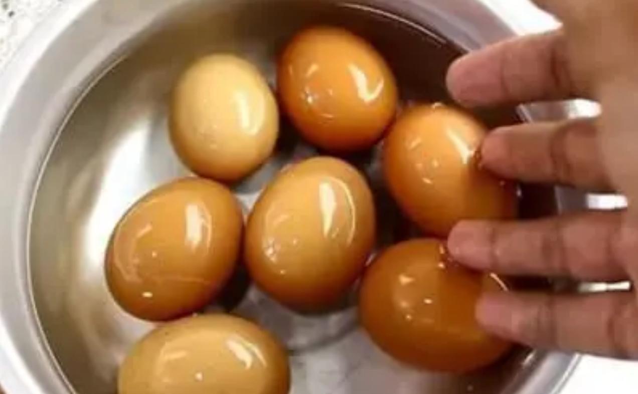 Marinated eggs in soy sauce in a steel bowl — protein snack